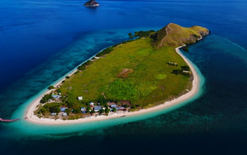 Crystal-clear water and coral reef near Kenawa Island, Indonesia