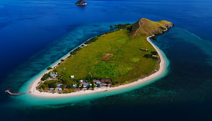 Crystal-clear water and coral reef near Kenawa Island, Indonesia